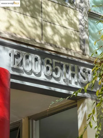 an aerial view of house with yard swimming pool and ocean view