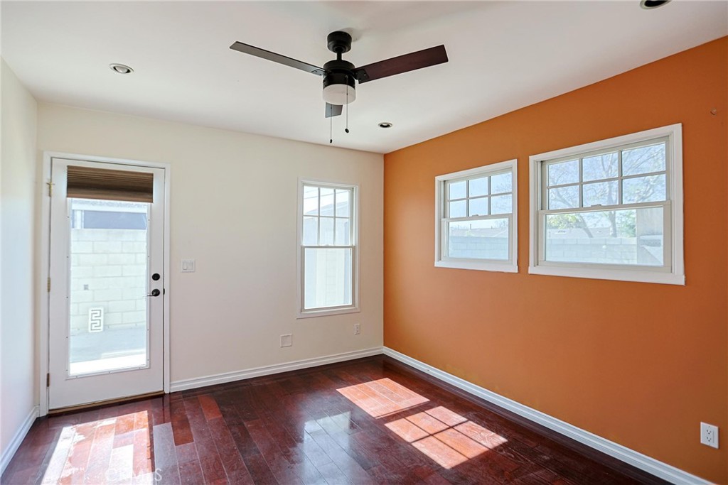 1014 Sheffield Street Santa Ana, CA 92703 - Photo 17 of 21 a view of an empty room with a window and wooden floor