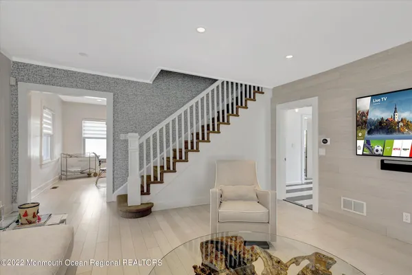 a living room with furniture and a flat screen tv