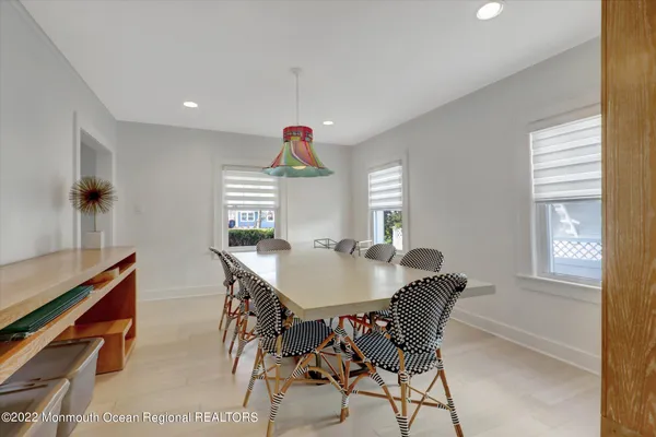 a view of a dining room with furniture and window