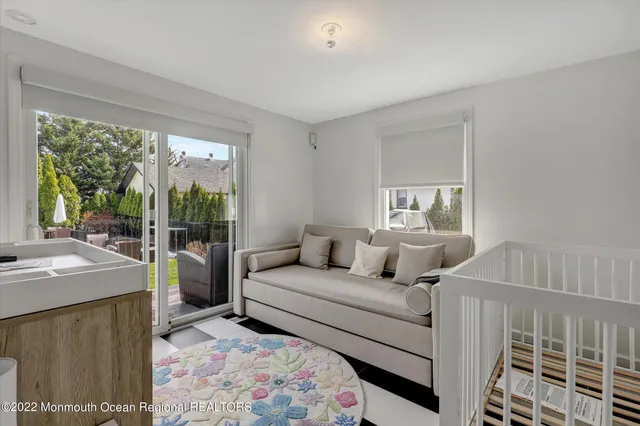 a bedroom with a bed and a night stand