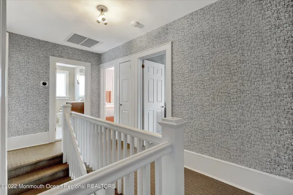 a view of a balcony with wooden floor