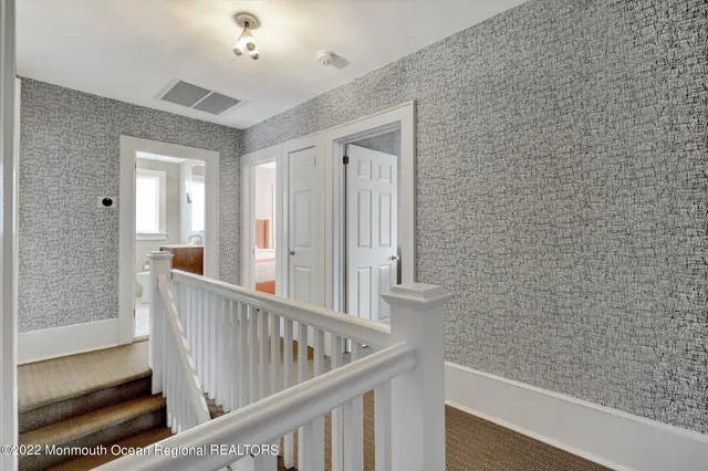 a view of a balcony with wooden floor