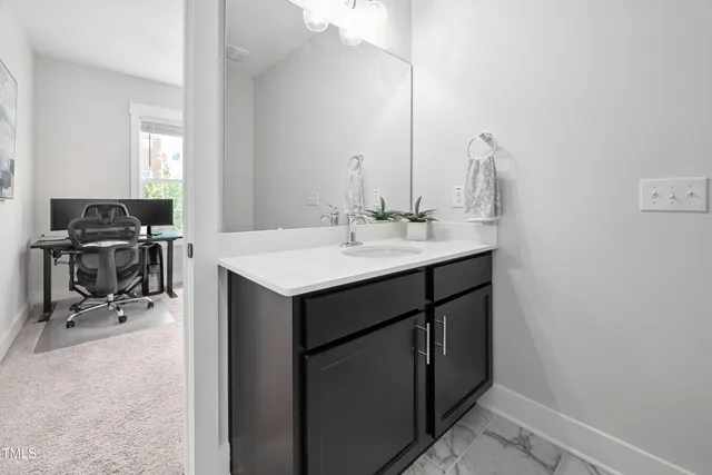 a kitchen with a sink cabinets and appliances