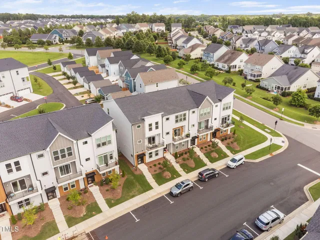 an aerial view of a house with a ocean view