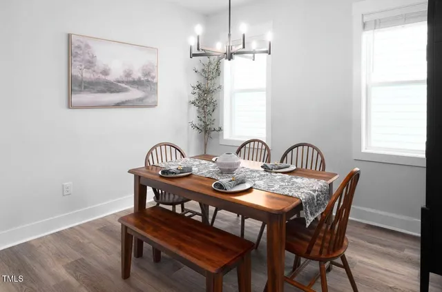 a dining room with furniture and window