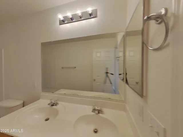 a view of an empty room and a window