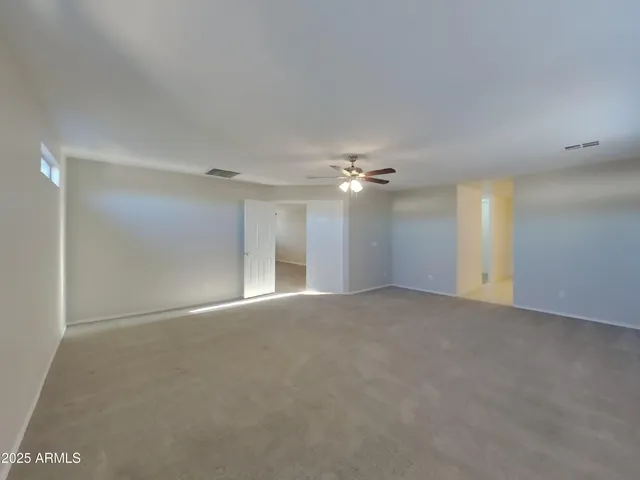 a kitchen with a refrigerator sink and cabinets