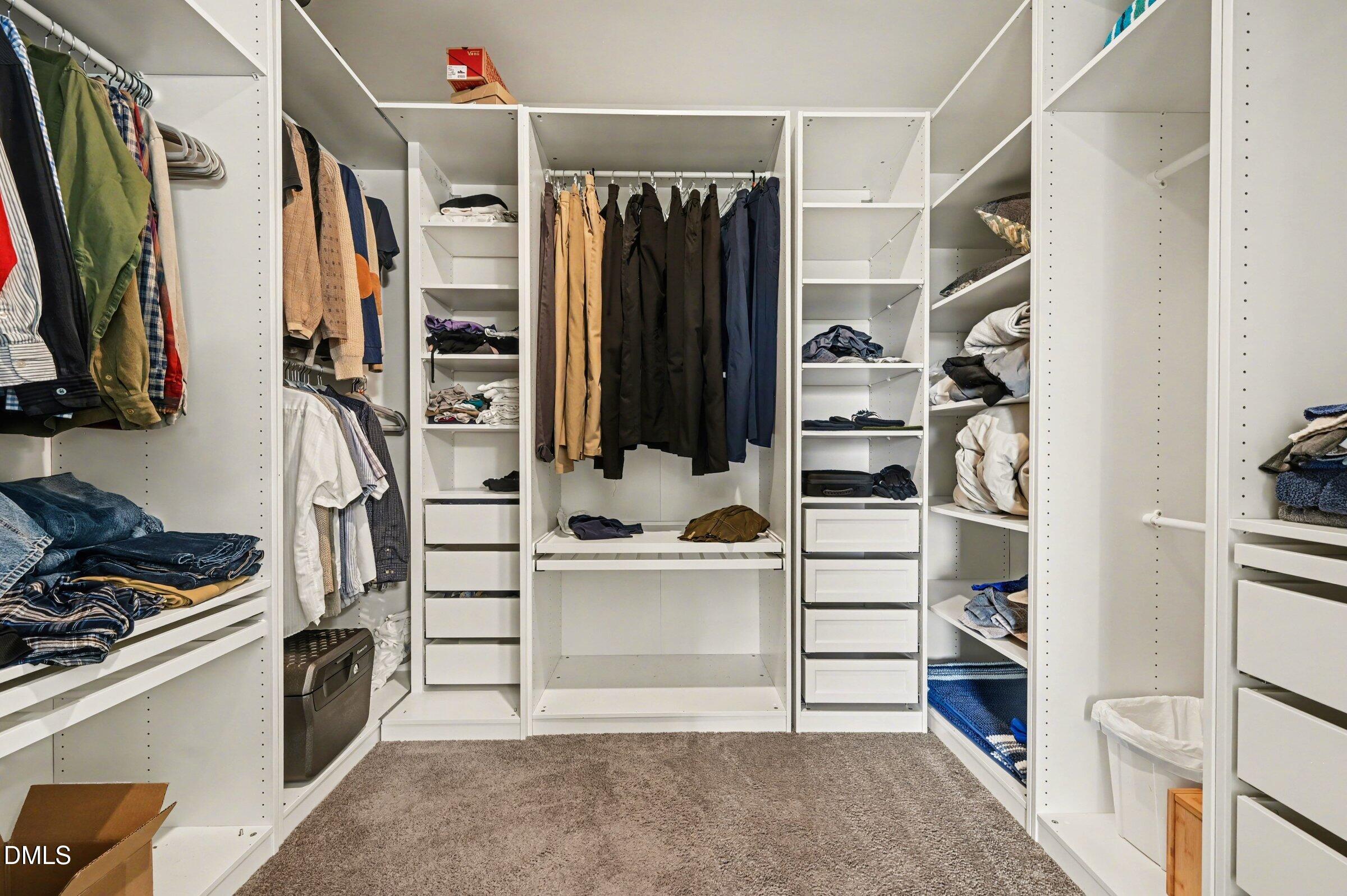 7015 Grainfield Road Mebane, NC 27302 - Photo 35 of 42 a view of walk in closet with clothes and shoes