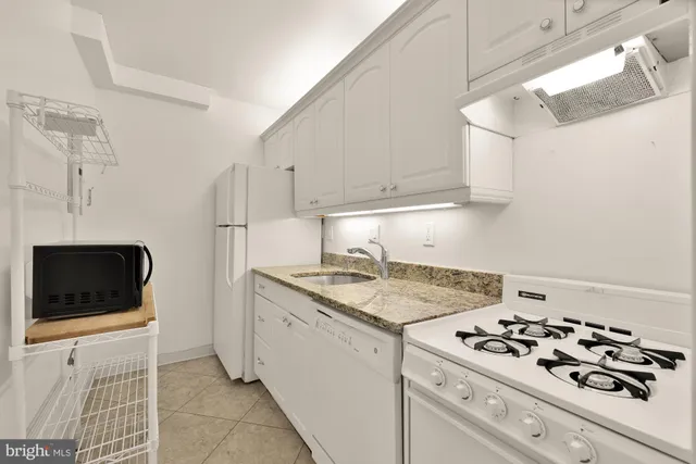 a kitchen with a sink and a stove