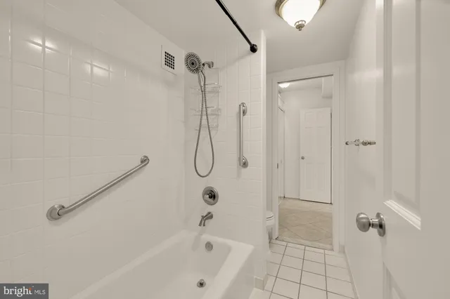 a bathroom with a shower and a toilet