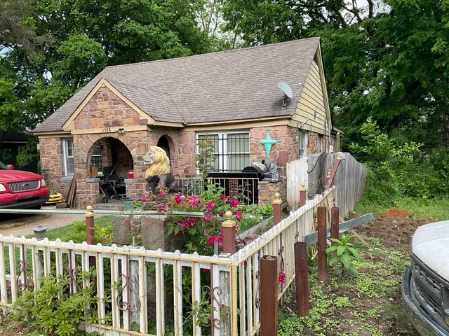 a front view of house and yard with seating space