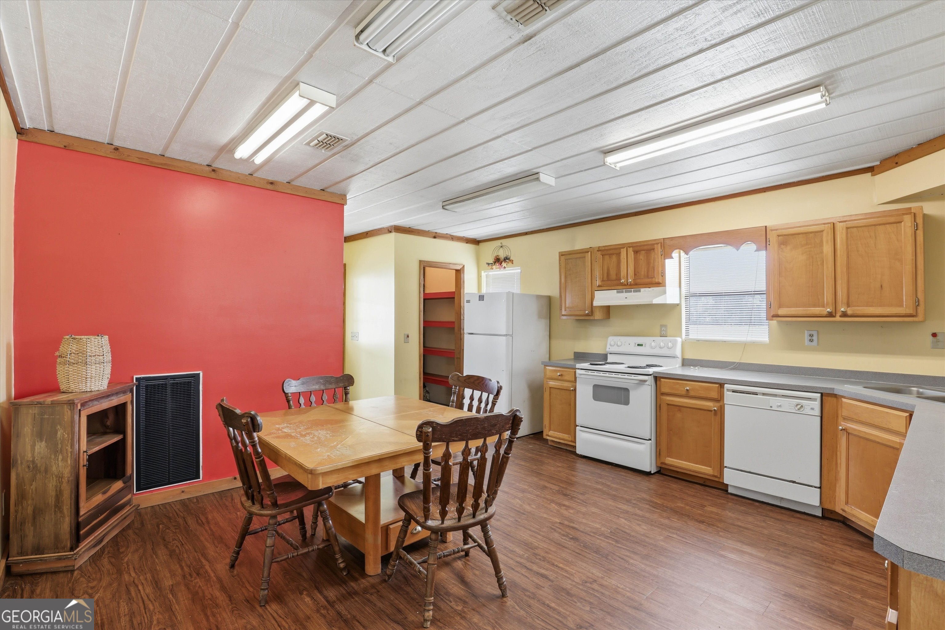 1525 Myron Hart Road Coolidge, GA 31738 - Photo 9 of 58 a view of a dining room with furniture window and wooden floor