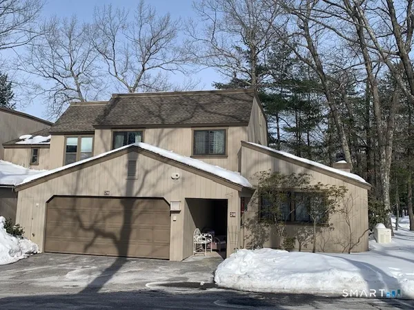 a view of a house with a street