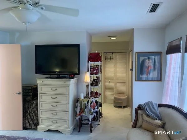 a room with furniture and a flat screen tv