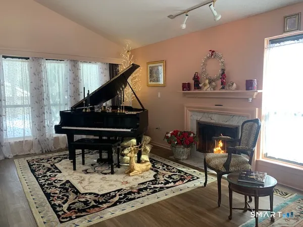 a living room with furniture and a fireplace