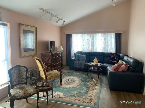 a living room with furniture and a rug