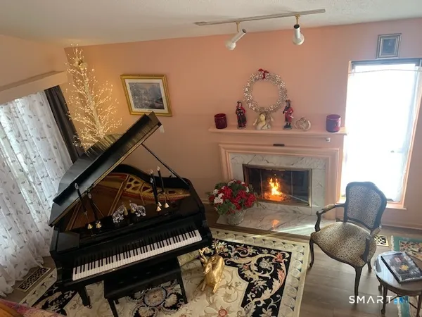 a living room with furniture and a fireplace