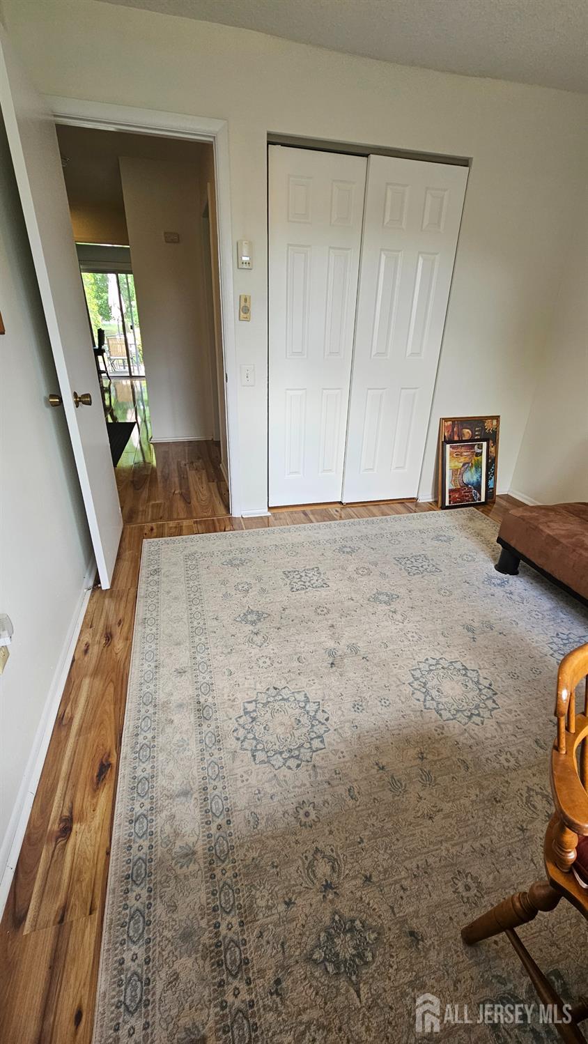 449 B Closter Road, Unit B Monroe Township, NJ 08831 - Photo 12 of 14 a view of hallway with wooden floor