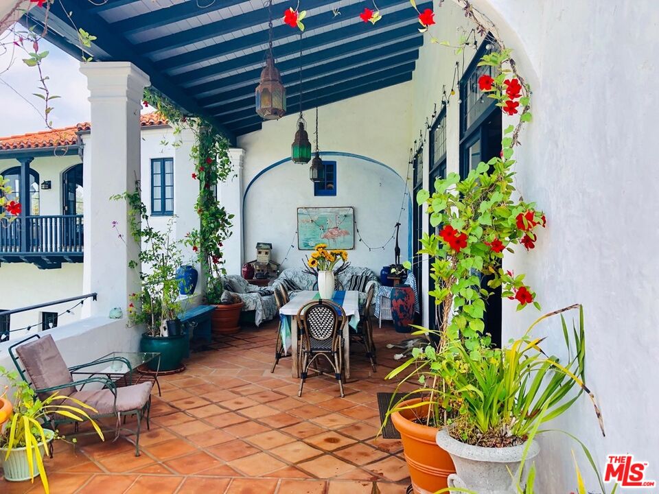 242 Mabery Road Santa Monica, CA 90402 - Photo 12 of 16 a dining room filled with furniture and a potted plant