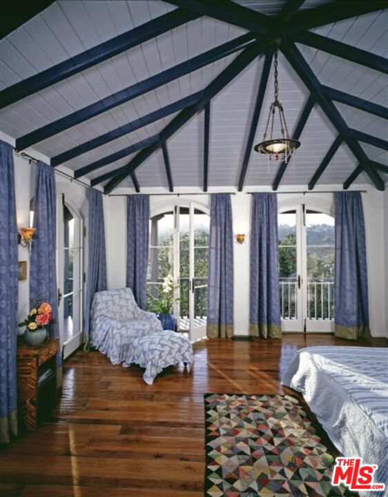 242 Mabery Road Santa Monica, CA 90402 - Photo 10 of 16 a bedroom with a bed and wooden floor