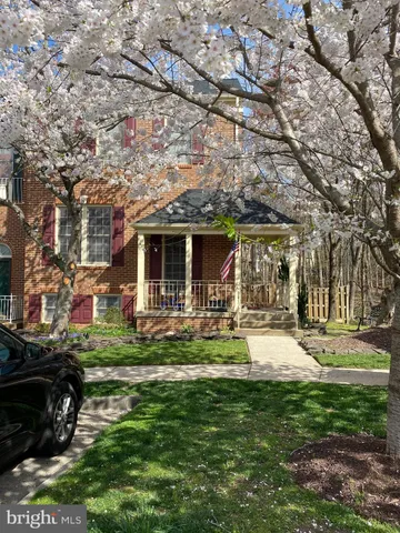 a front view of a house with swimming pool having outdoor seating