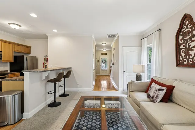 a living room with furniture and a rug