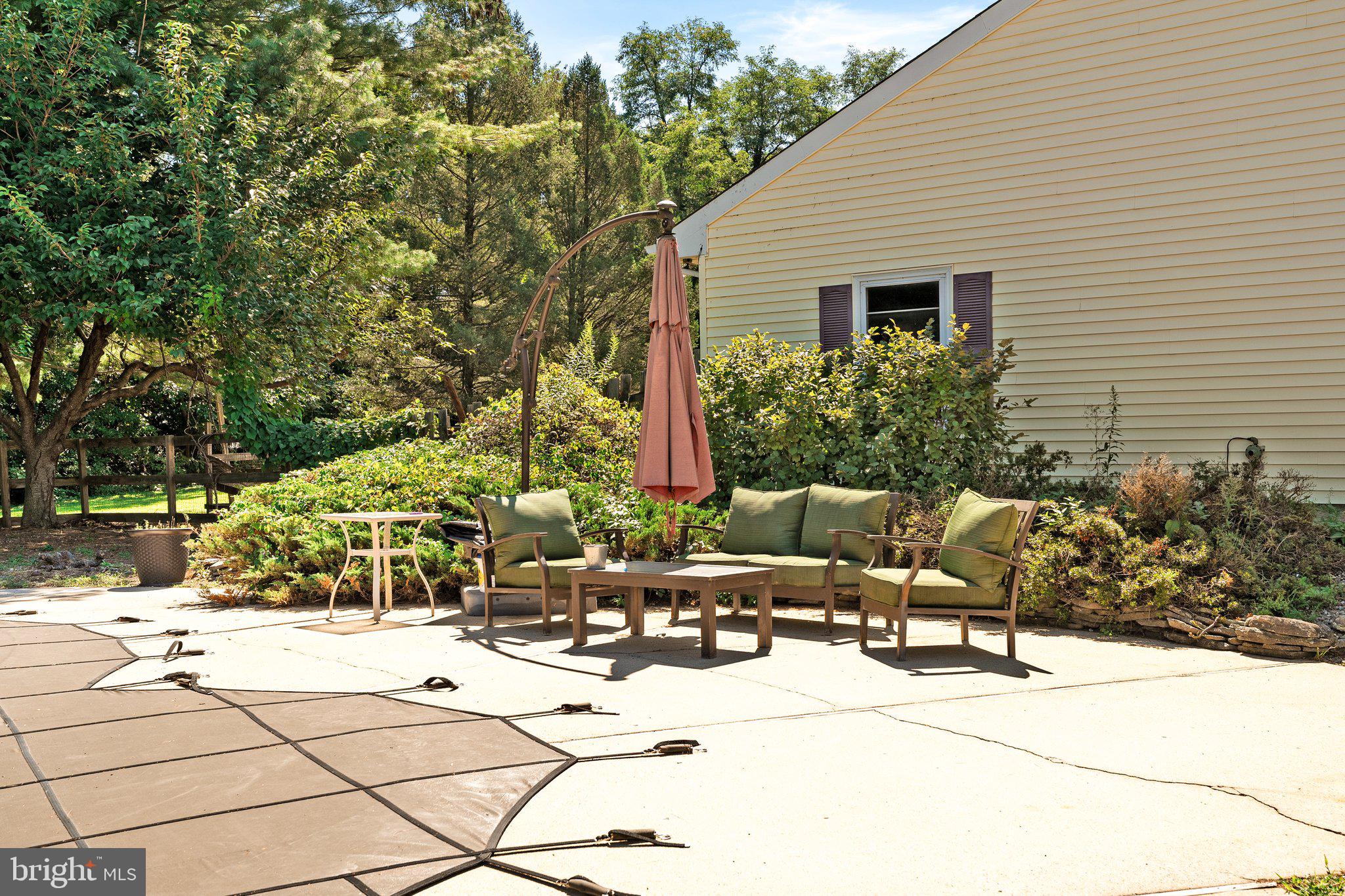87 Bordentown Chesterfield Road Chesterfield, NJ 08515 - Photo 27 of 49 a view of backyard with outdoor seating and plants