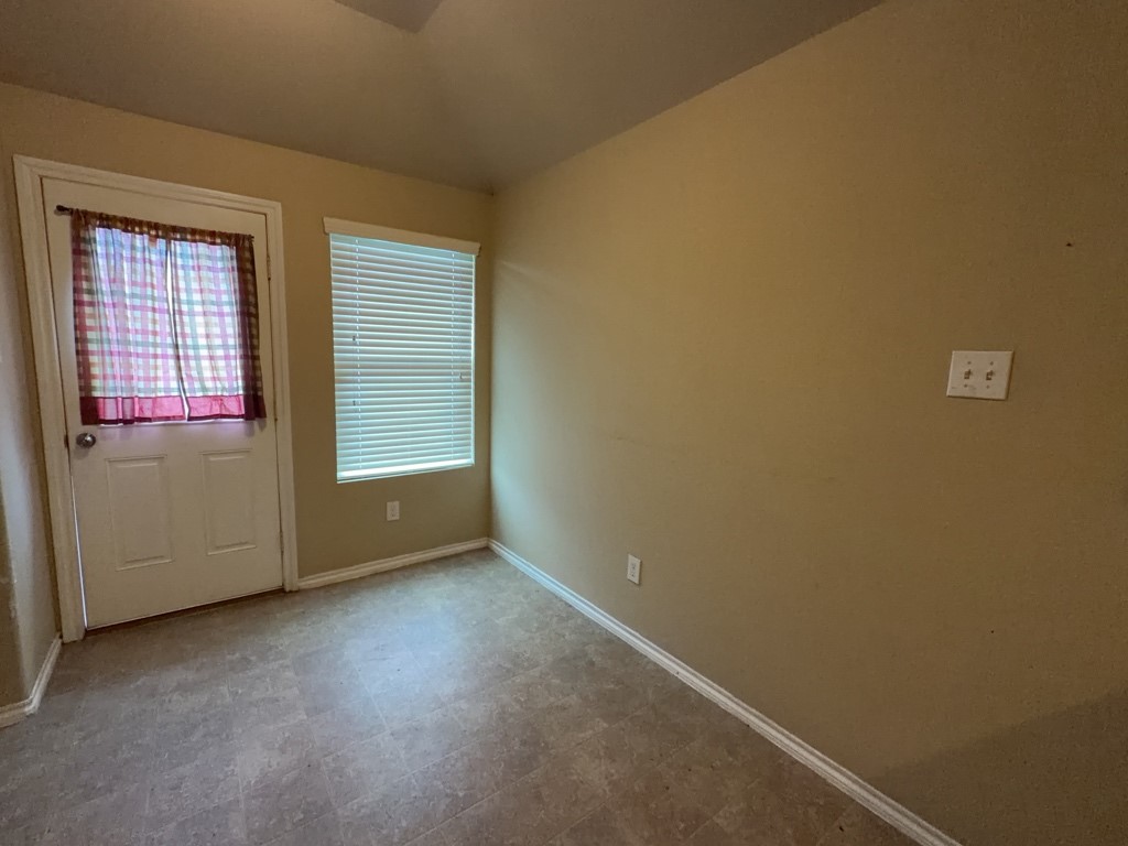 811 Lovebug Lane Conroe, TX 77301 - Photo 2 of 9 an empty room with windows