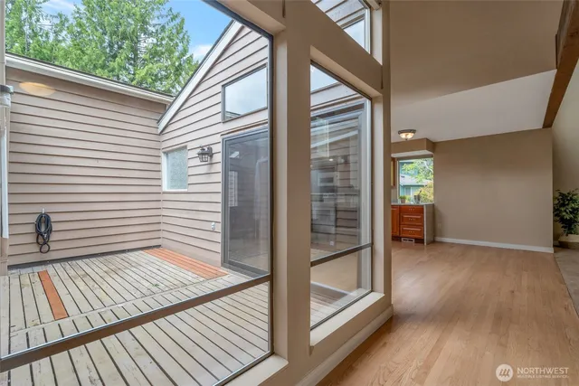 a view of outdoor space with porch and wooden floor