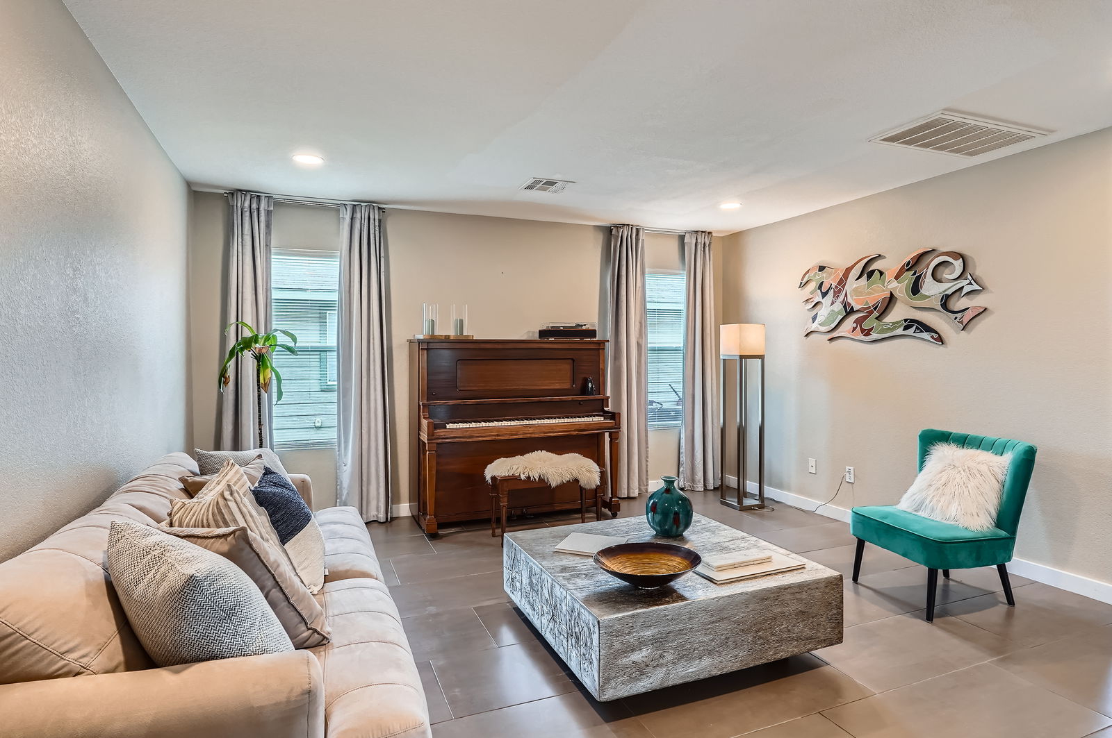 18021 Prairie Verbena Lane Elgin, TX 78621 - Photo 4 of 33 Recessed lighting illuminates this inviting living space, creating a warm and relaxed atmosphere.