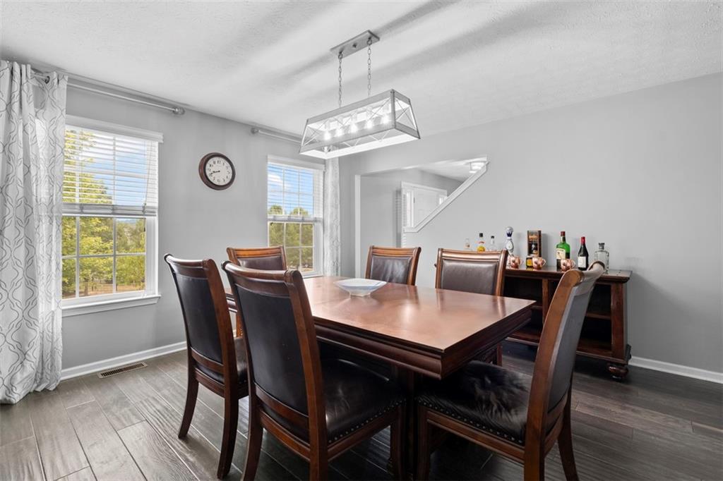 145 Brighton Lane Mars, PA 16046 - Photo 11 of 44 a view of a dining room with furniture window and wooden floor