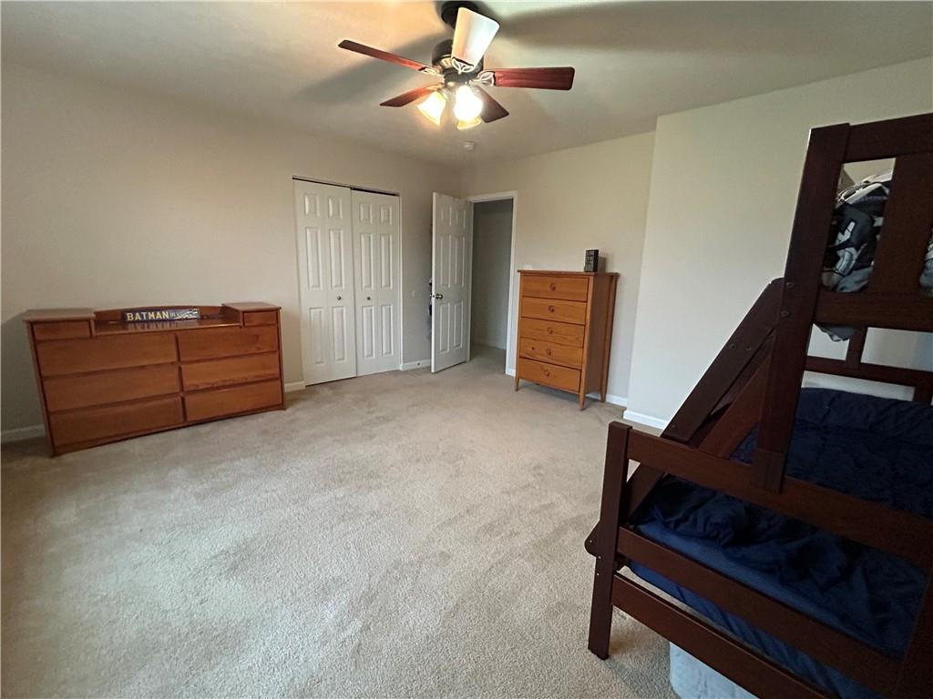 145 Brighton Lane Mars, PA 16046 - Photo 26 of 44 a living room with furniture and a ceiling fan