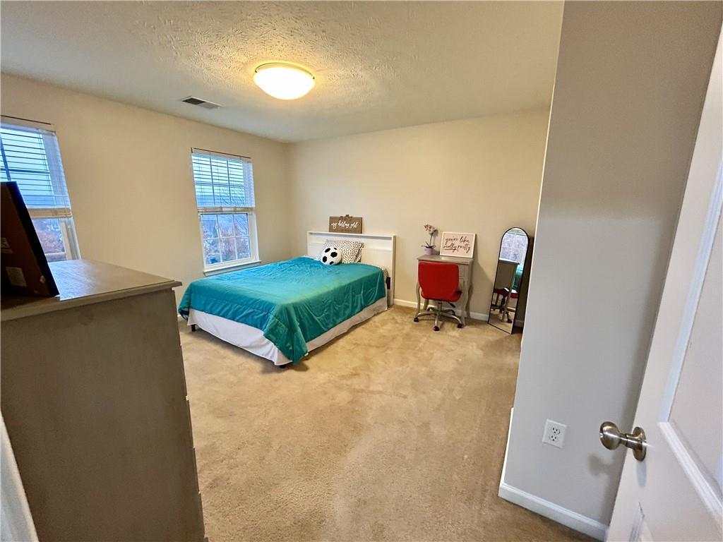 145 Brighton Lane Mars, PA 16046 - Photo 27 of 44 a bedroom with two beds and a window