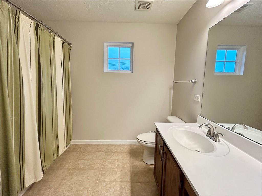 145 Brighton Lane Mars, PA 16046 - Photo 31 of 44 a bathroom with a sink a toilet and shower