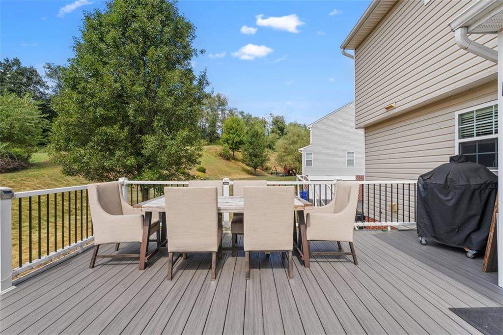 145 Brighton Lane Mars, PA 16046 - Photo 35 of 44 a view of a deck with table and chairs and wooden floor