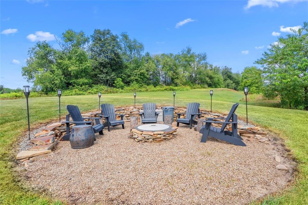 145 Brighton Lane Mars, PA 16046 - Photo 36 of 44 a view of a lake with furniture and garden