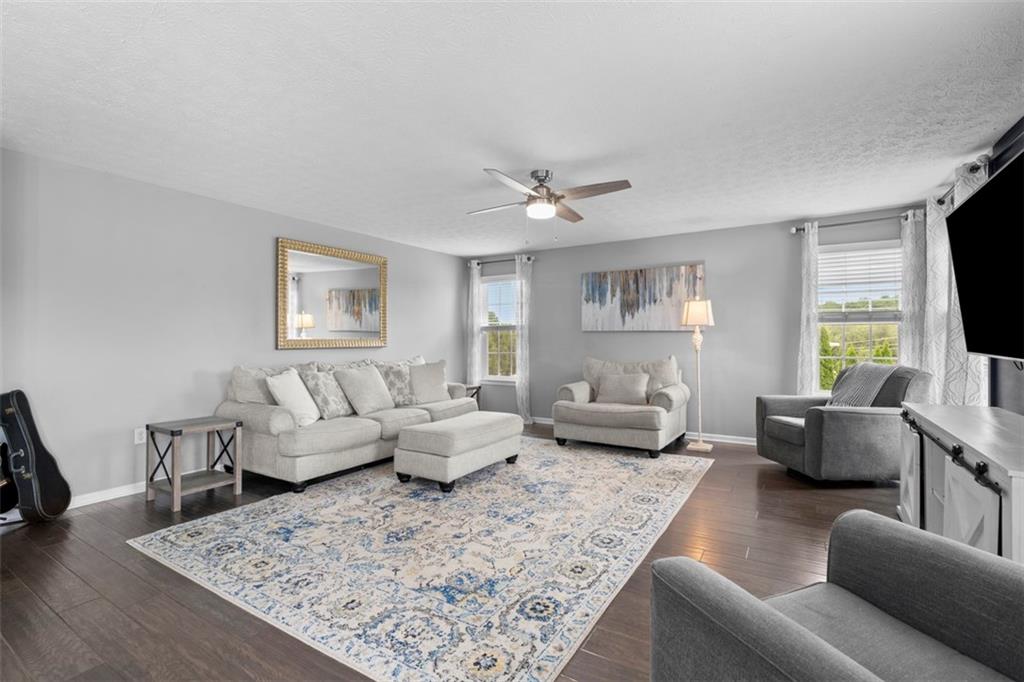 145 Brighton Lane Mars, PA 16046 - Photo 5 of 44 a living room with furniture and a flat screen tv