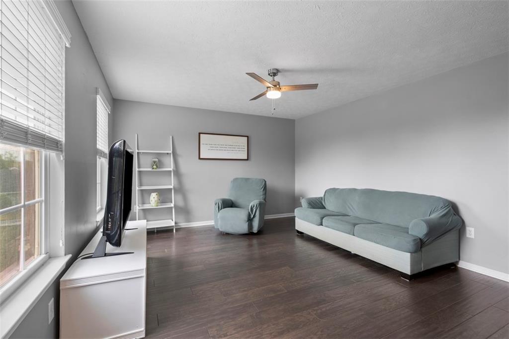 145 Brighton Lane Mars, PA 16046 - Photo 7 of 44 a living room with furniture and a wooden floor