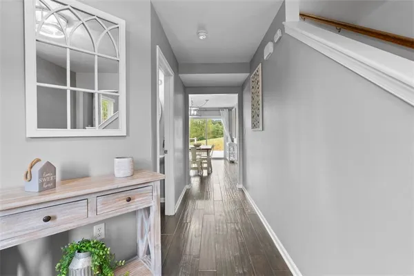 a hallway with front door wooden floor and front door