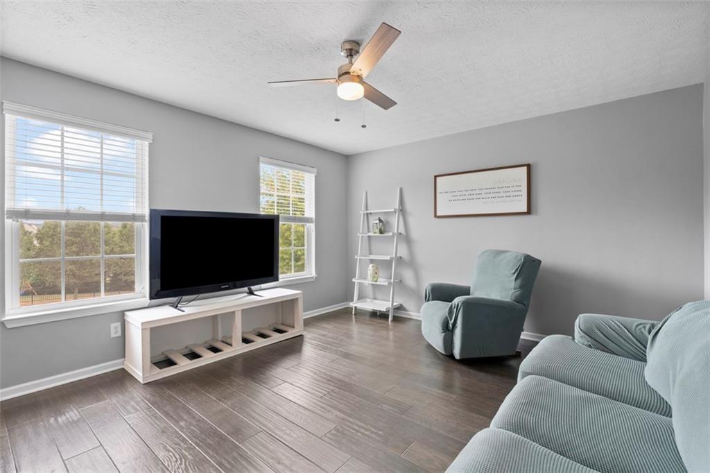 145 Brighton Lane Mars, PA 16046 - Photo 9 of 44 a living room with furniture and a flat screen tv