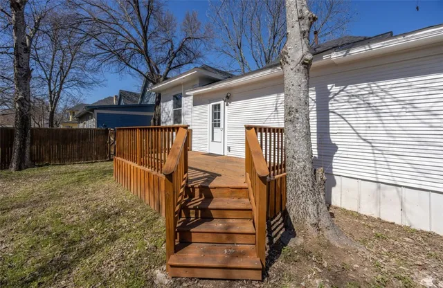 a view of a house with a small yard