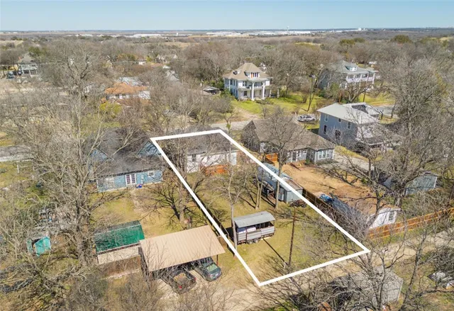 an aerial view of a house with a swimming pool