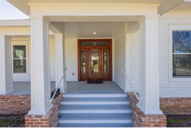a view of livingroom with hardwood floor and furniture
