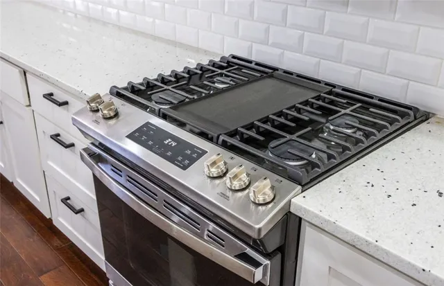 a kitchen with a refrigerator and window