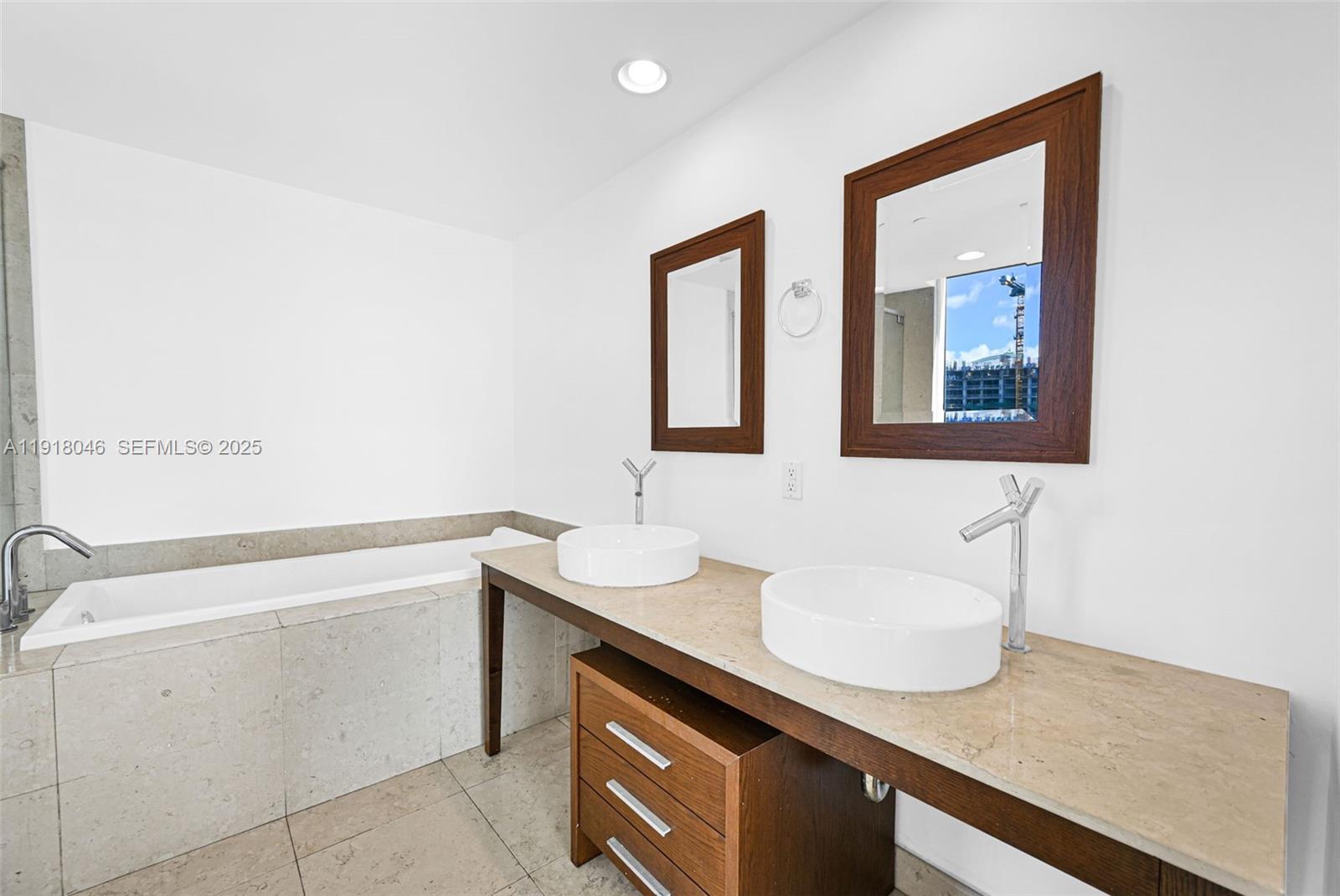 475 Brickell Avenue, Unit 3113 Miami, FL 33131 - Photo 12 of 28 a bathroom with a sink and a mirror