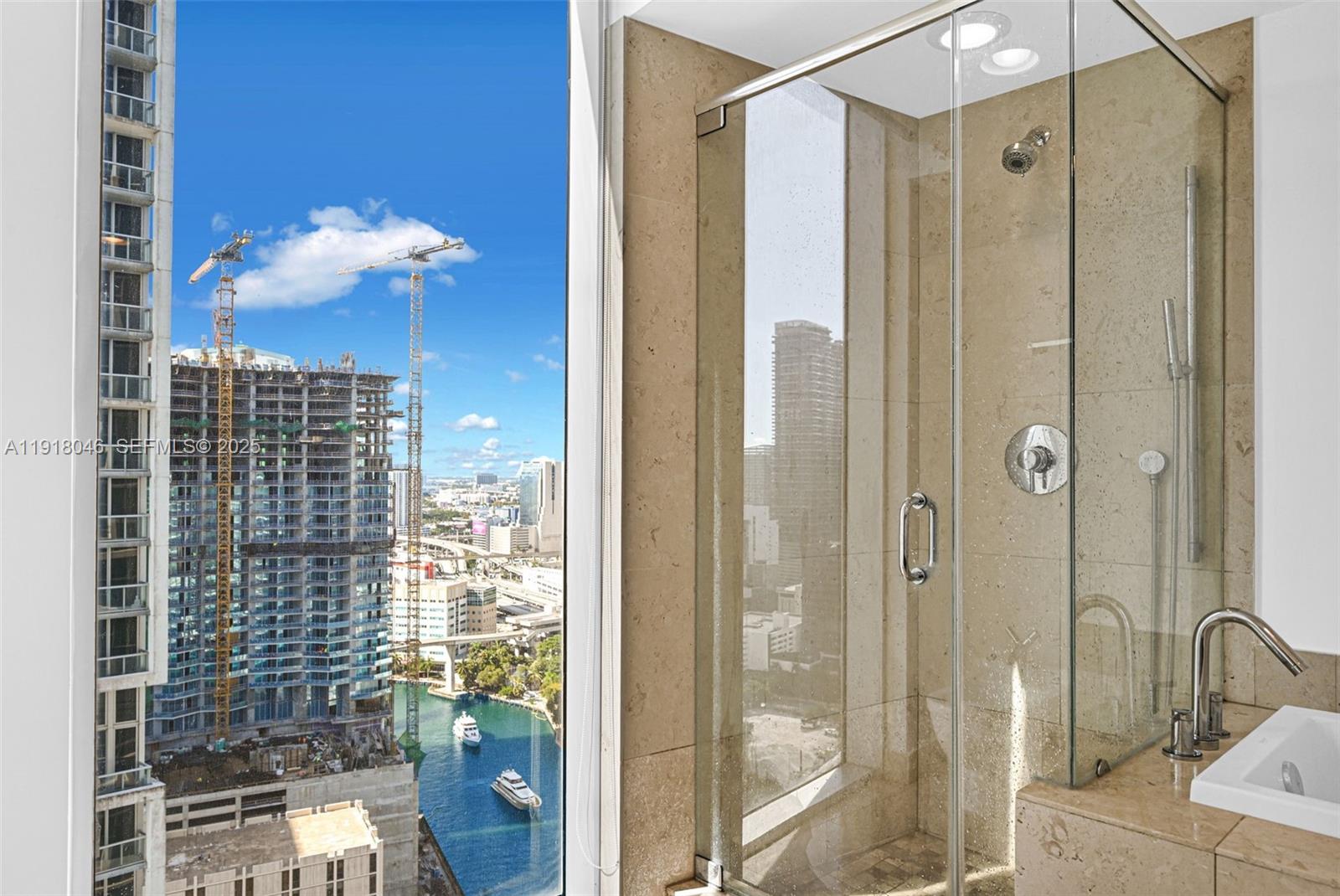 475 Brickell Avenue, Unit 3113 Miami, FL 33131 - Photo 15 of 28 a bathroom with a shower
