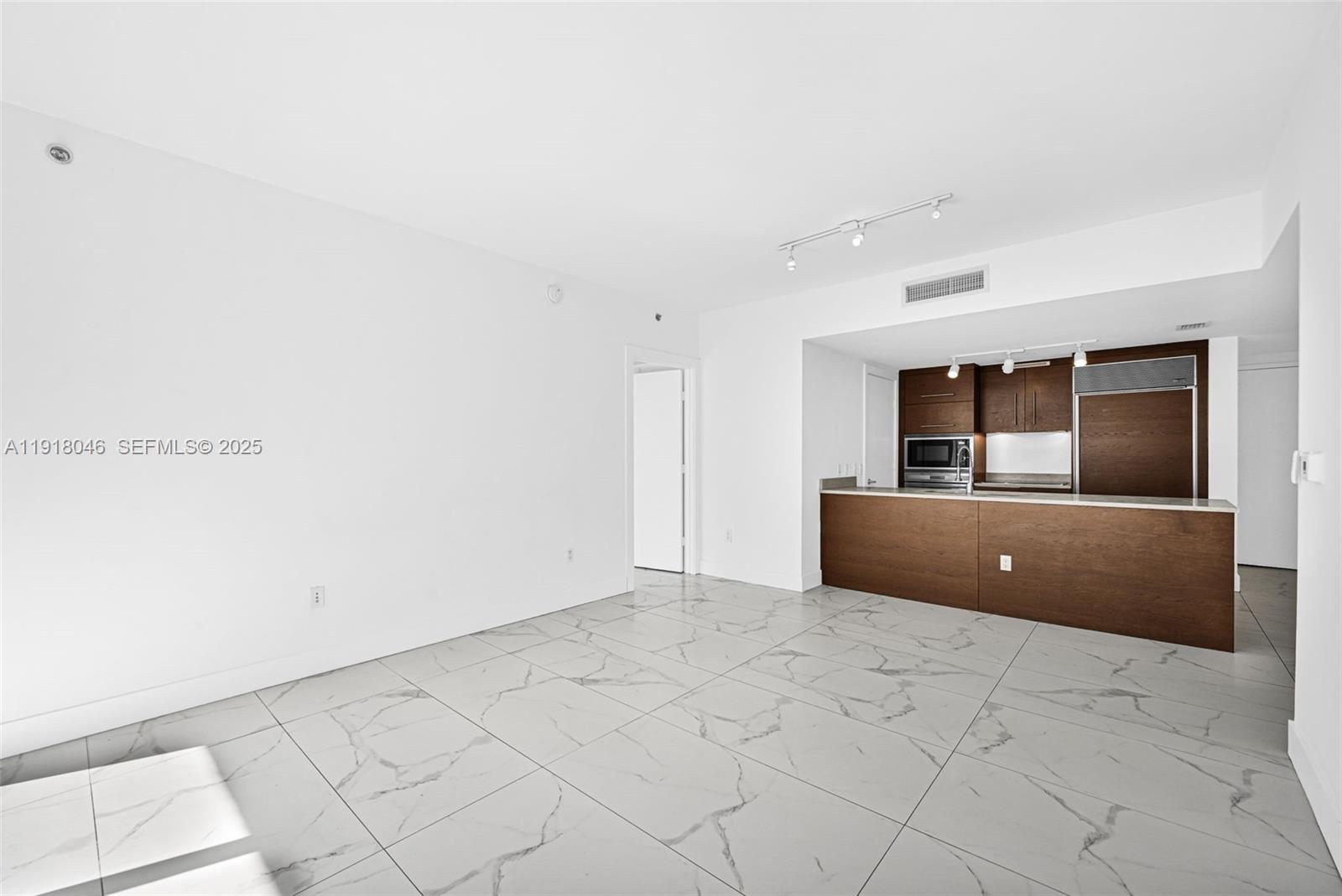 475 Brickell Avenue, Unit 3113 Miami, FL 33131 - Photo 2 of 28 a view of an empty room and window