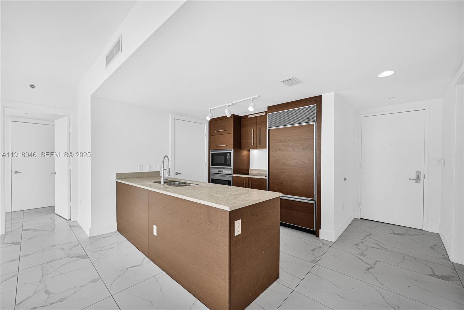 475 Brickell Avenue, Unit 3113 Miami, FL 33131 - Photo 4 of 28 a room with a cabinets and stainless steel appliances