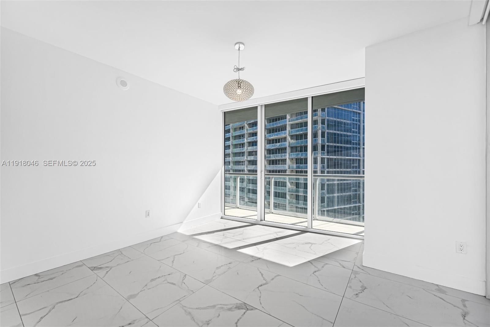 475 Brickell Avenue, Unit 3113 Miami, FL 33131 - Photo 9 of 28 a view of an empty room with a window